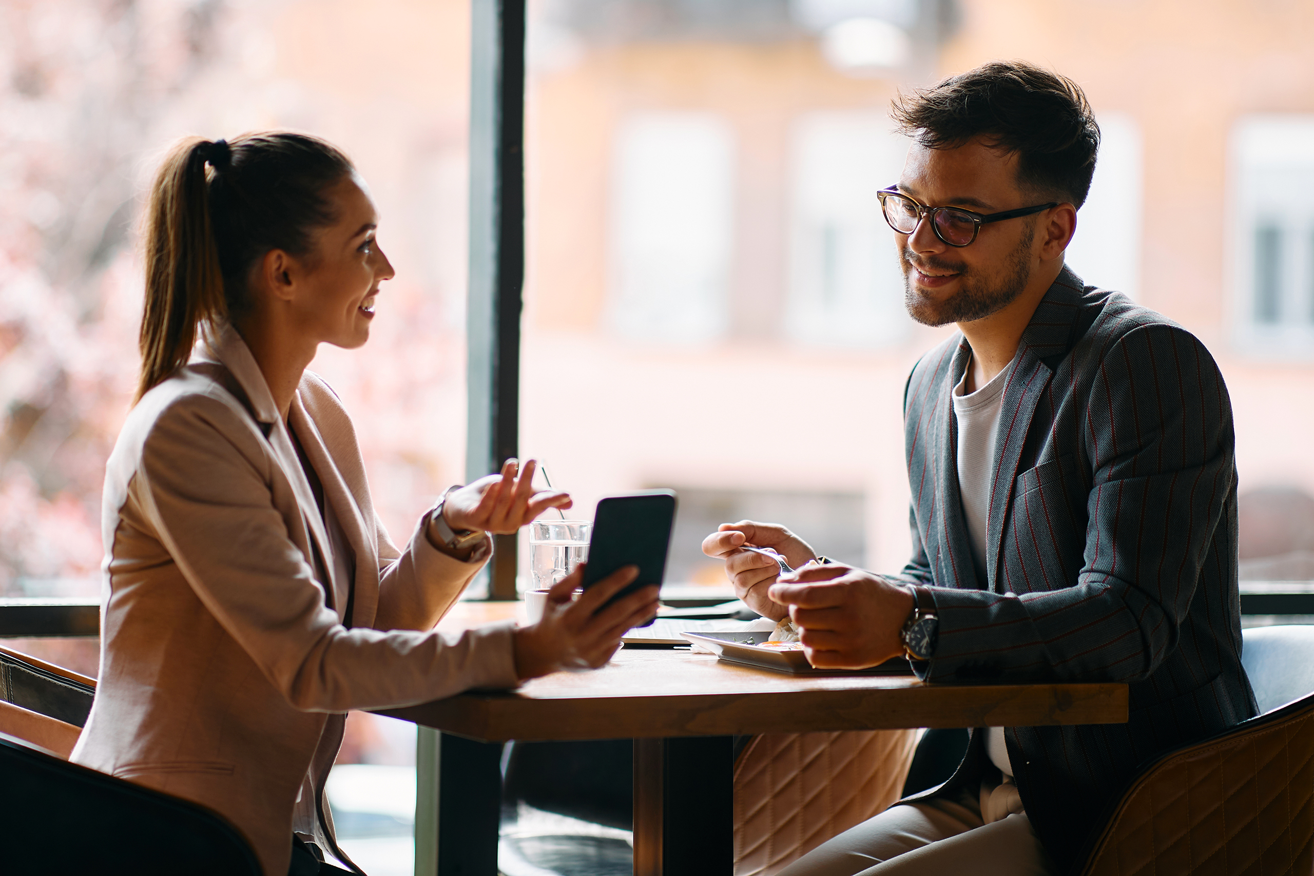 Young banking customer consulting with financial mentor